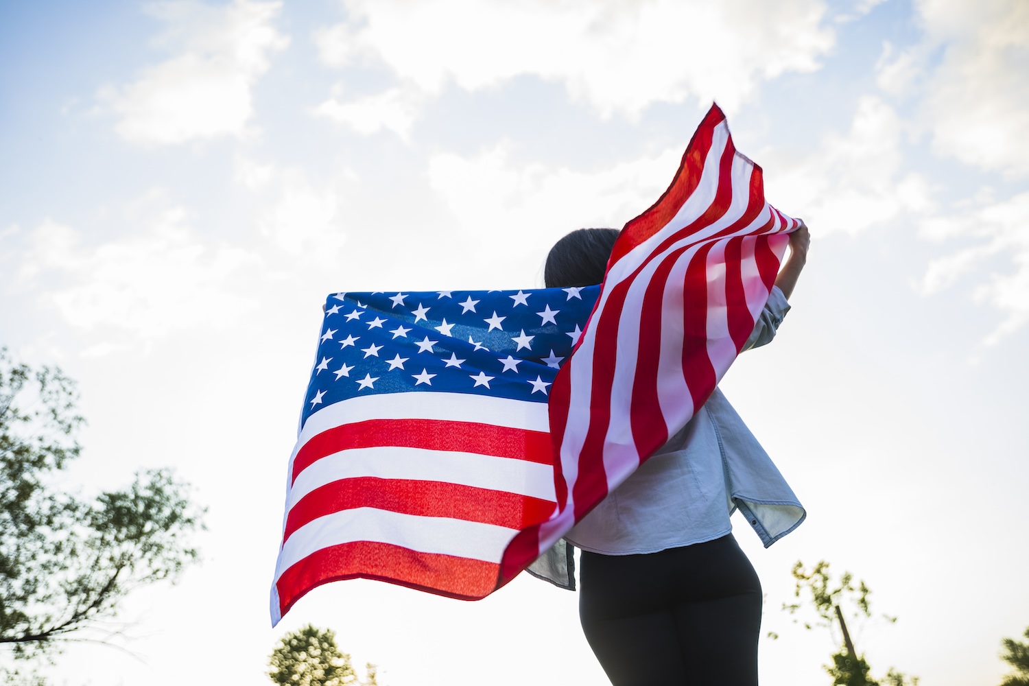 Woman holding American flag